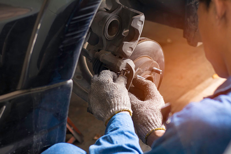 Brake disc and calliper during workshop servicing